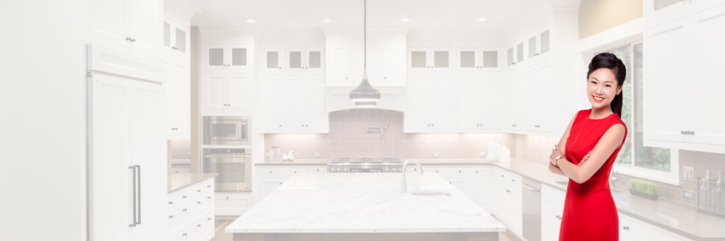 a white kitchen with a large island